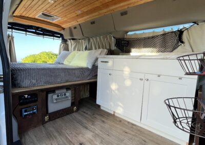 Interior view of Carlos camper van with bed and storage